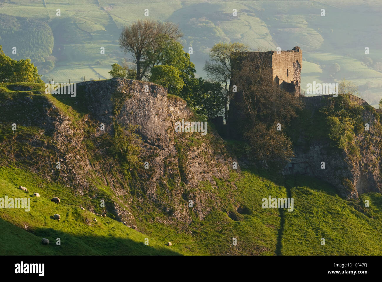 A view of Peveril castle perched on a rocky outcrop in the Peak District Stock Photo