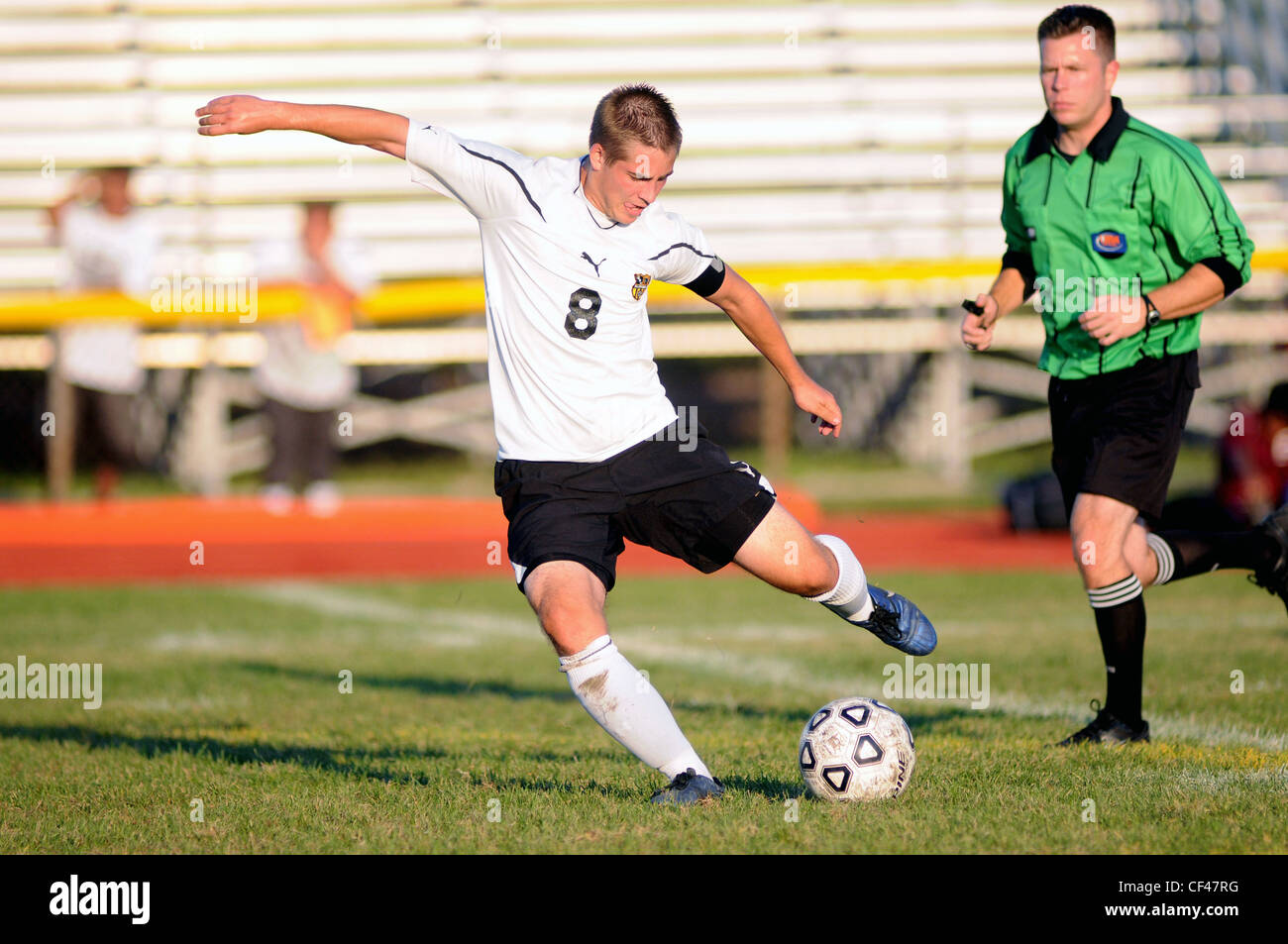 Player gets off an uncontested shot during a high school soccer match. USA. Stock Photo