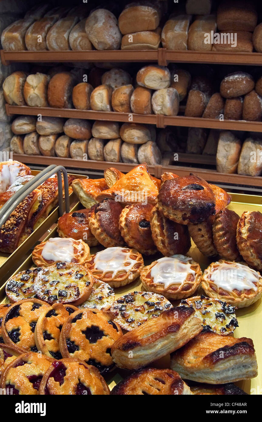 Viennoiseries Brioches And Buns On Display And Shelves With Loaves Of Fresh Baked Bread On Display In Bakery Belgium Stock Photo Alamy