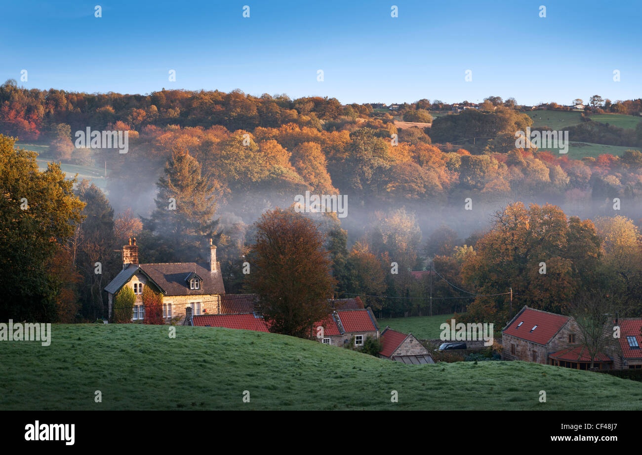 Early morning mist lingering over the small village of Egton Bridge and surrounding countryside. Stock Photo
