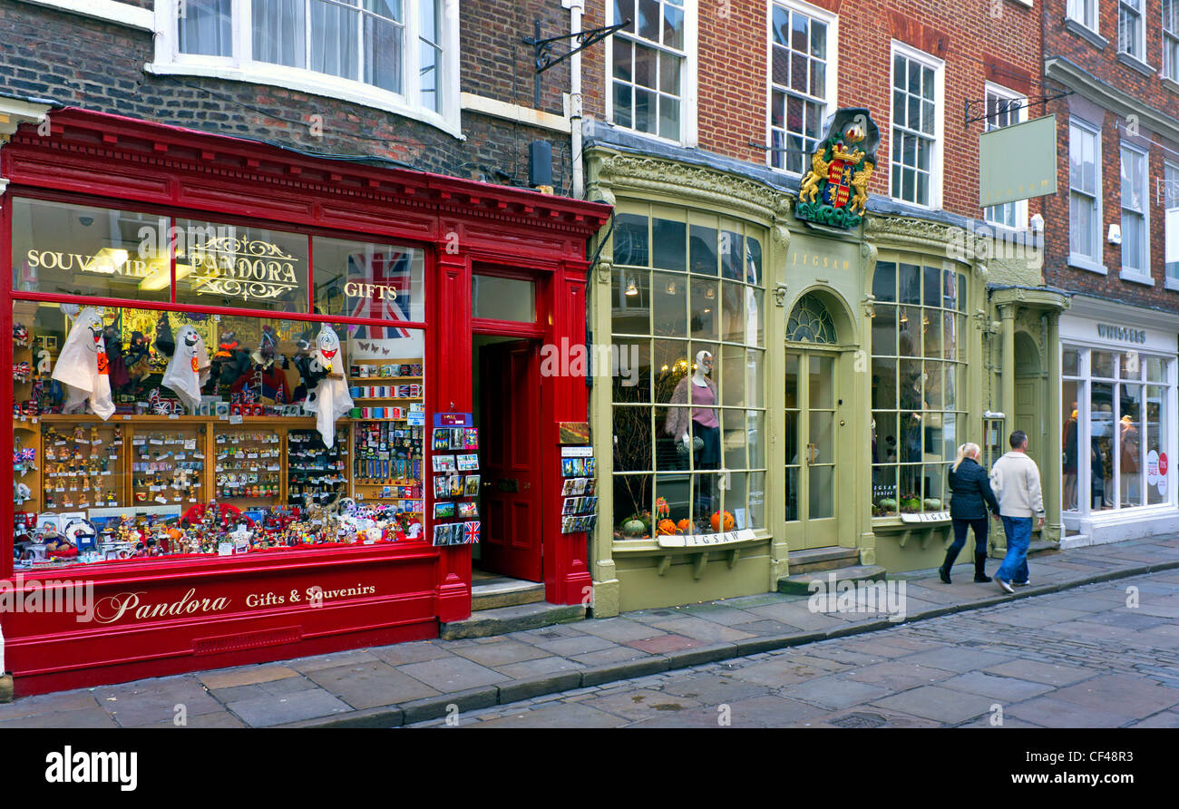 Shops in Stonegate, York.  Stonegate has always been central to York's layout.  Six feet below its pavement lies the Roman Via P Stock Photo