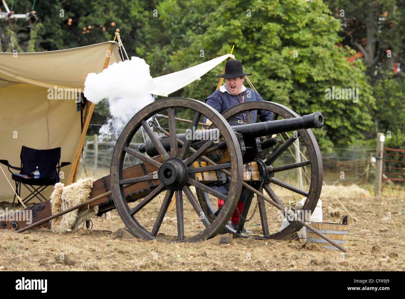 Gun being fired in an English civil war re-enactment near Saffron Walden in Essex. Stock Photo