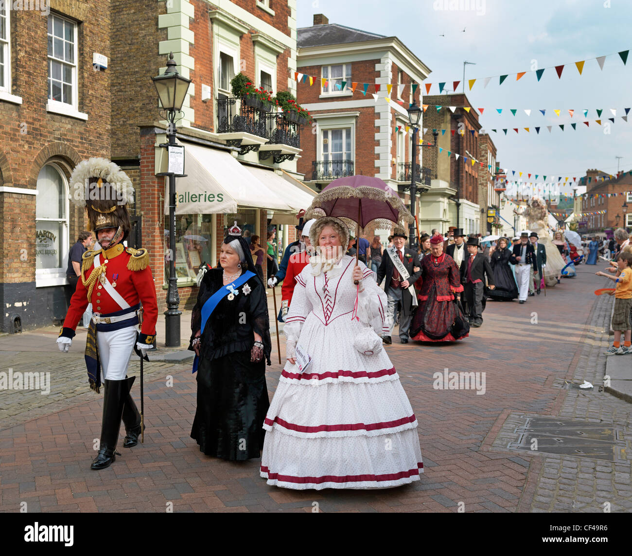 People parading through Rochester in Victorian costumes at the Dickens Festival 2010. Stock Photo