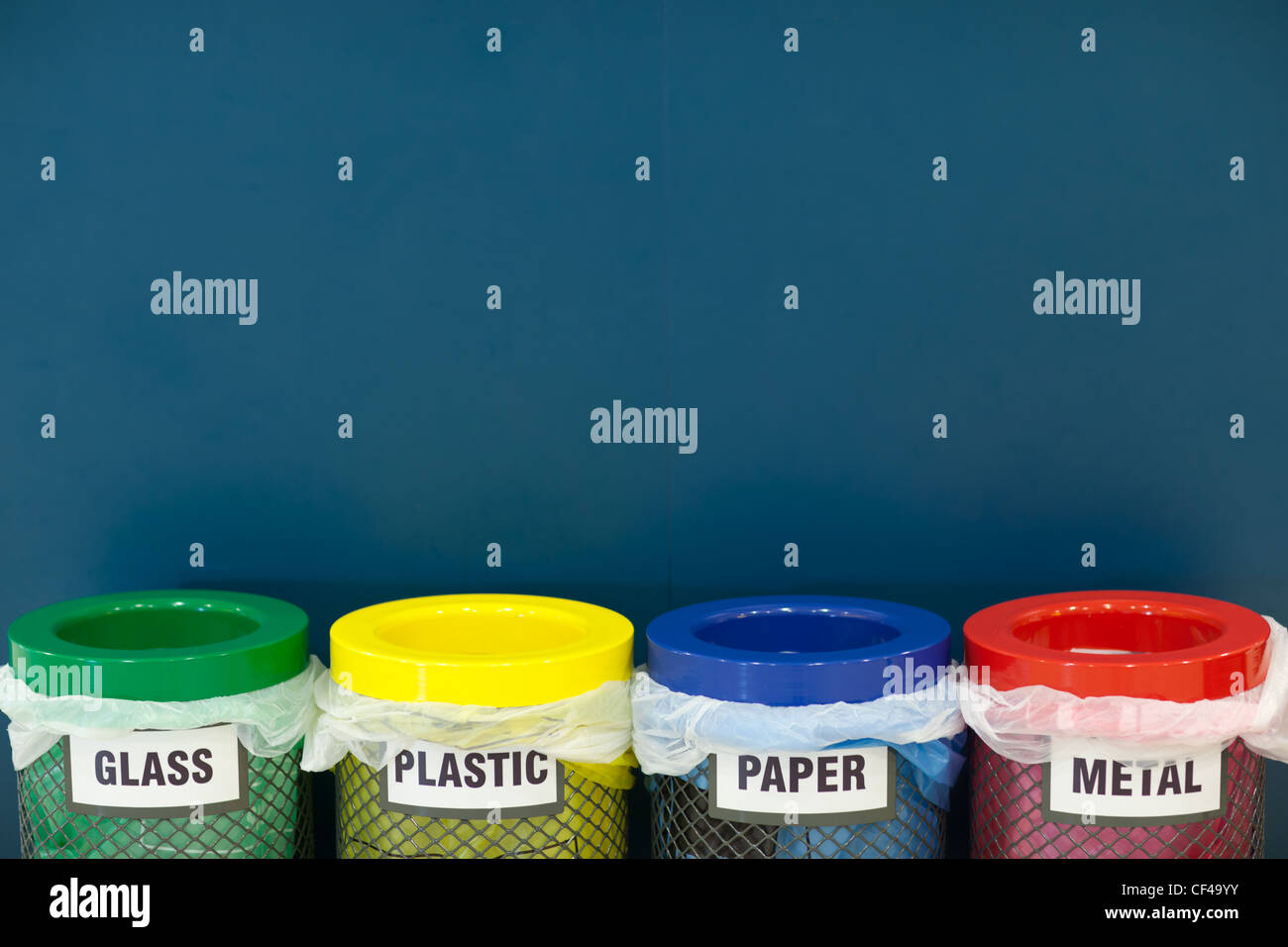 waste disposal series - colorful recycle bins (color toned image; shallow DOF) Stock Photo