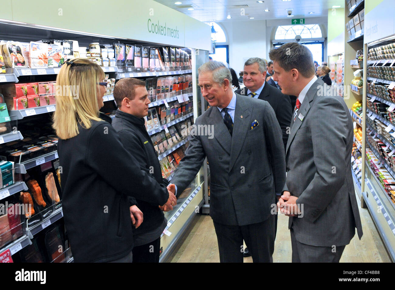 Prince Charles opens Little Waitrose Supermarket in Poundbury, Dorset UK, meets and talks to Waitrose staff and suppliers. Stock Photo