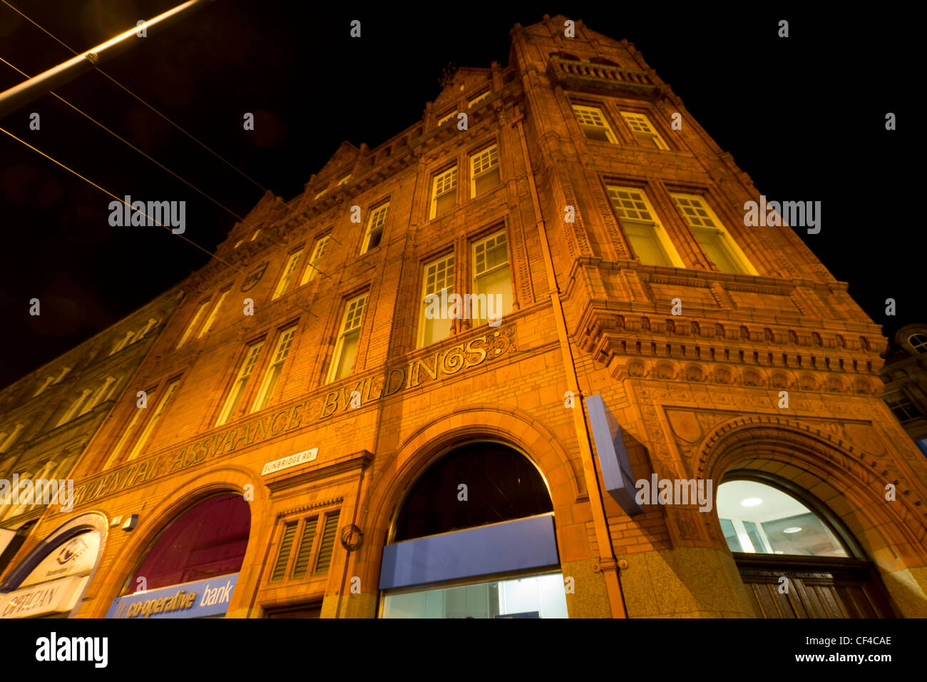 The Co-Operative Bank, Sunbridge Road Bradford, photographed at night. Built in 1985 of red brick and terracotta. Stock Photo