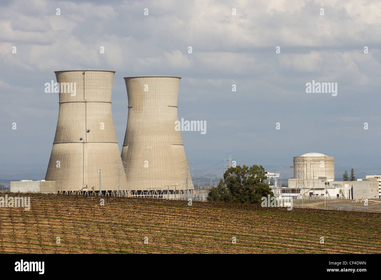 Decommissioned Nuclear power plant in Sacramento, California showing grape vines in the fields surrounding the cooling towers. Stock Photo