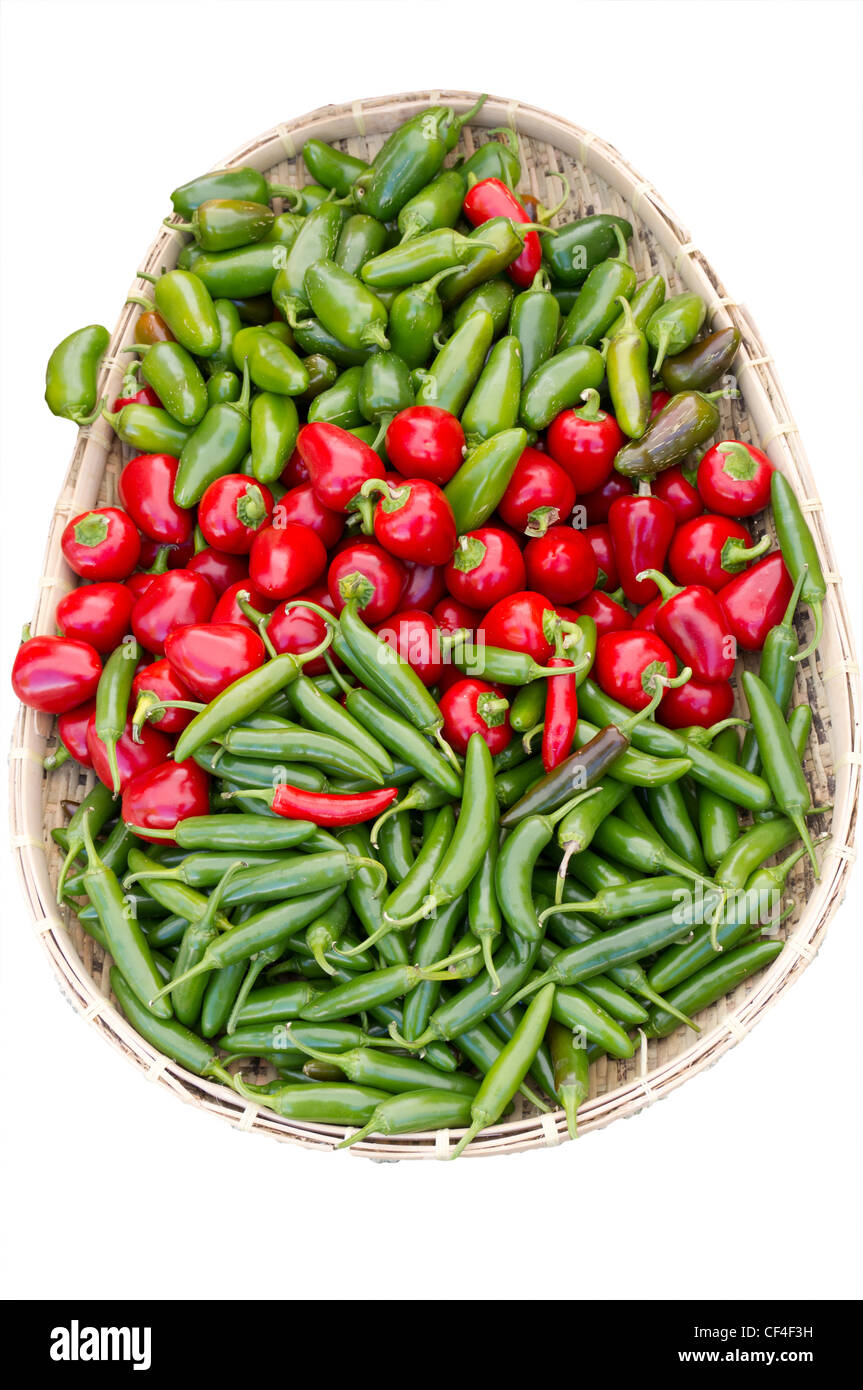 Colorful wicker basket of assorted peppers on display at the farmers ...