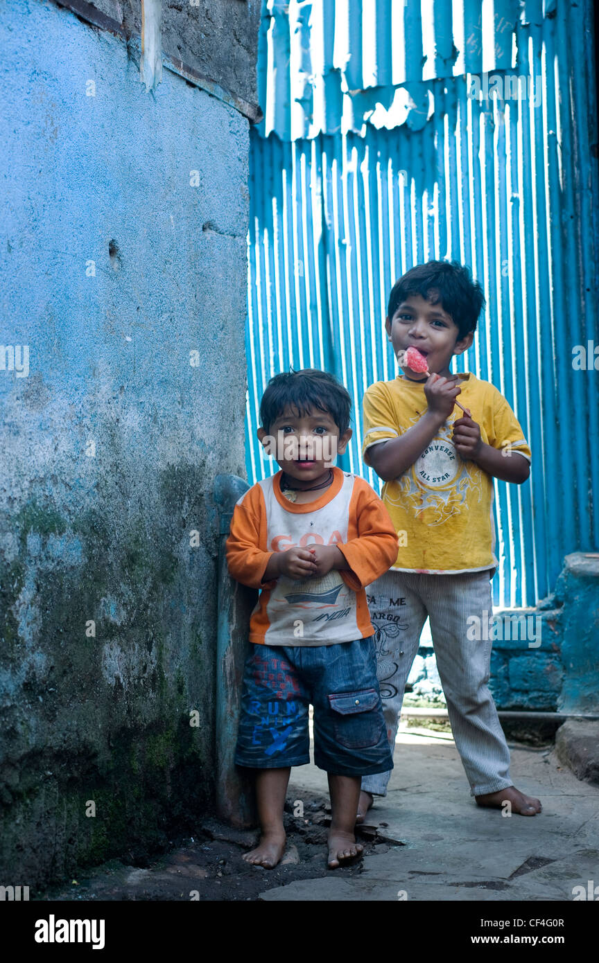 Young Kids (Boys) posing for the camera - Annawadi, Mumbai, India Stock Photo