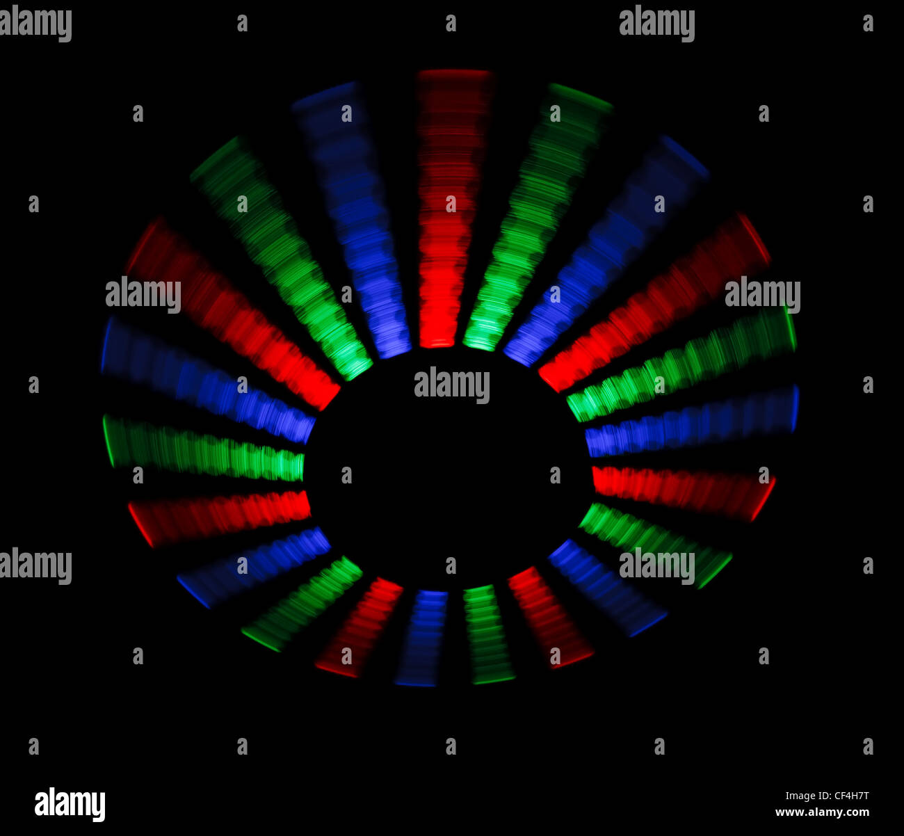 Colorful trace rotating LED in form of a disc on a black background. Stock Photo