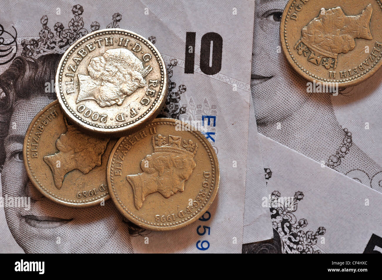 Pound coins and ten pound notes, Sterling currency UK Stock Photo