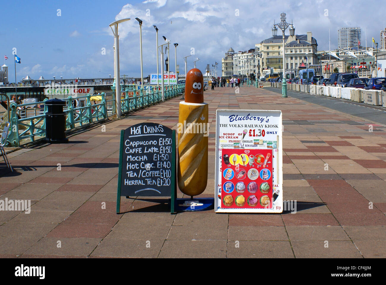 A smiling hot dog and cafe menus on Brighton promenade. Stock Photo