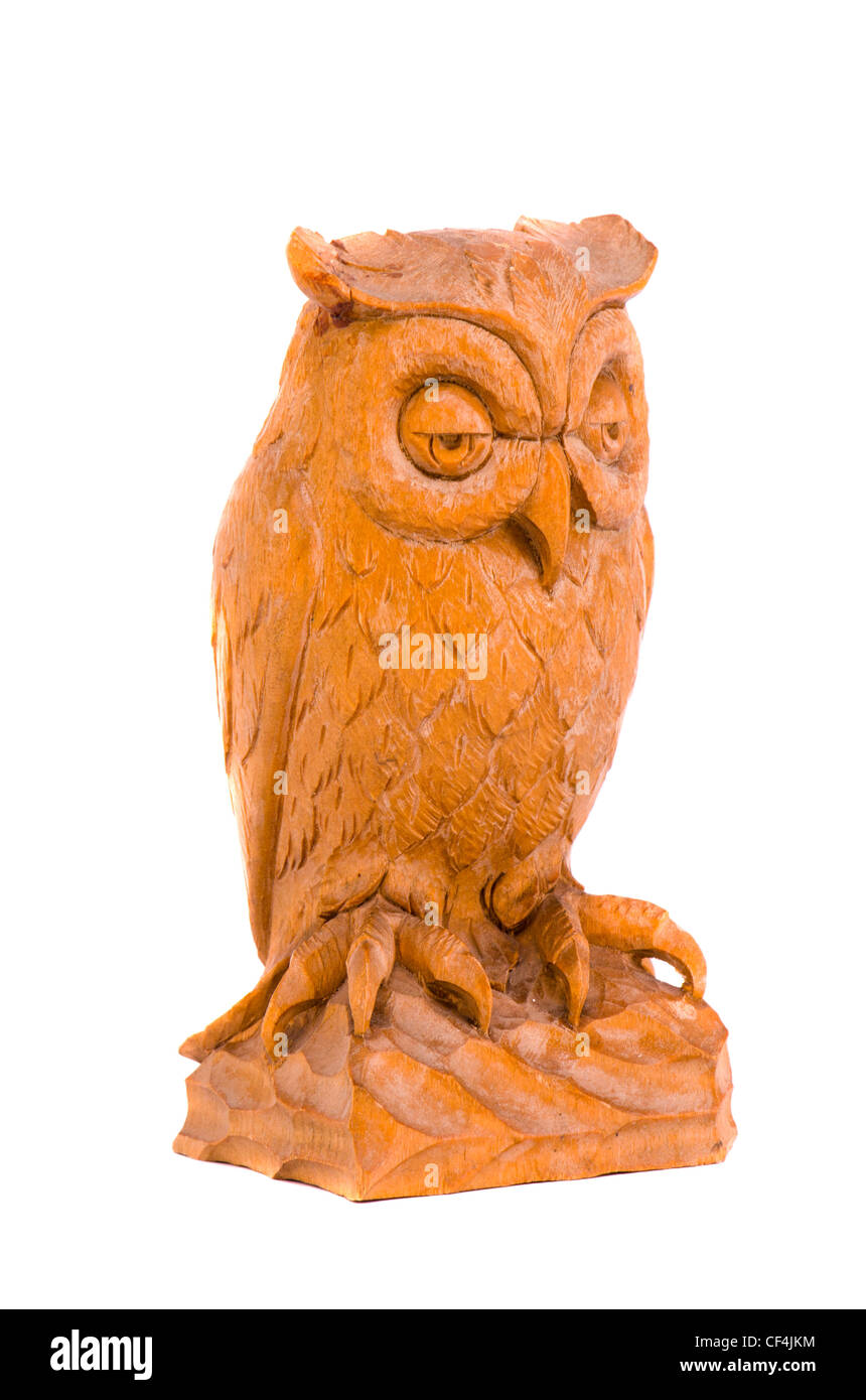 isolated on white wooden owl souvenir Stock Photo