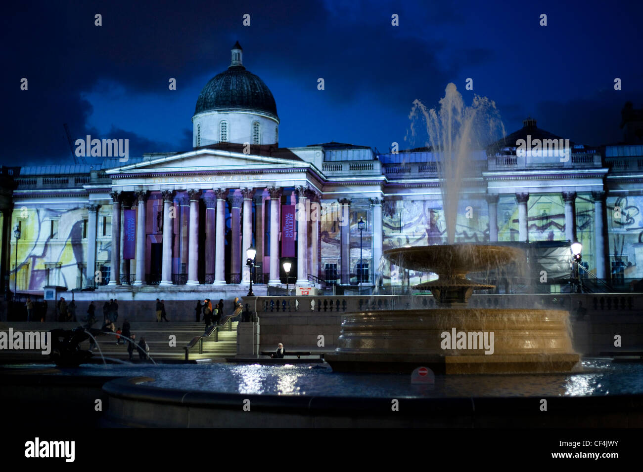 The National Gallery lit by the projected images of Picasso. Stock Photo