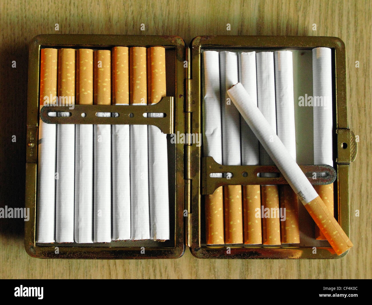 Cigarettes in a metal case Stock Photo - Alamy