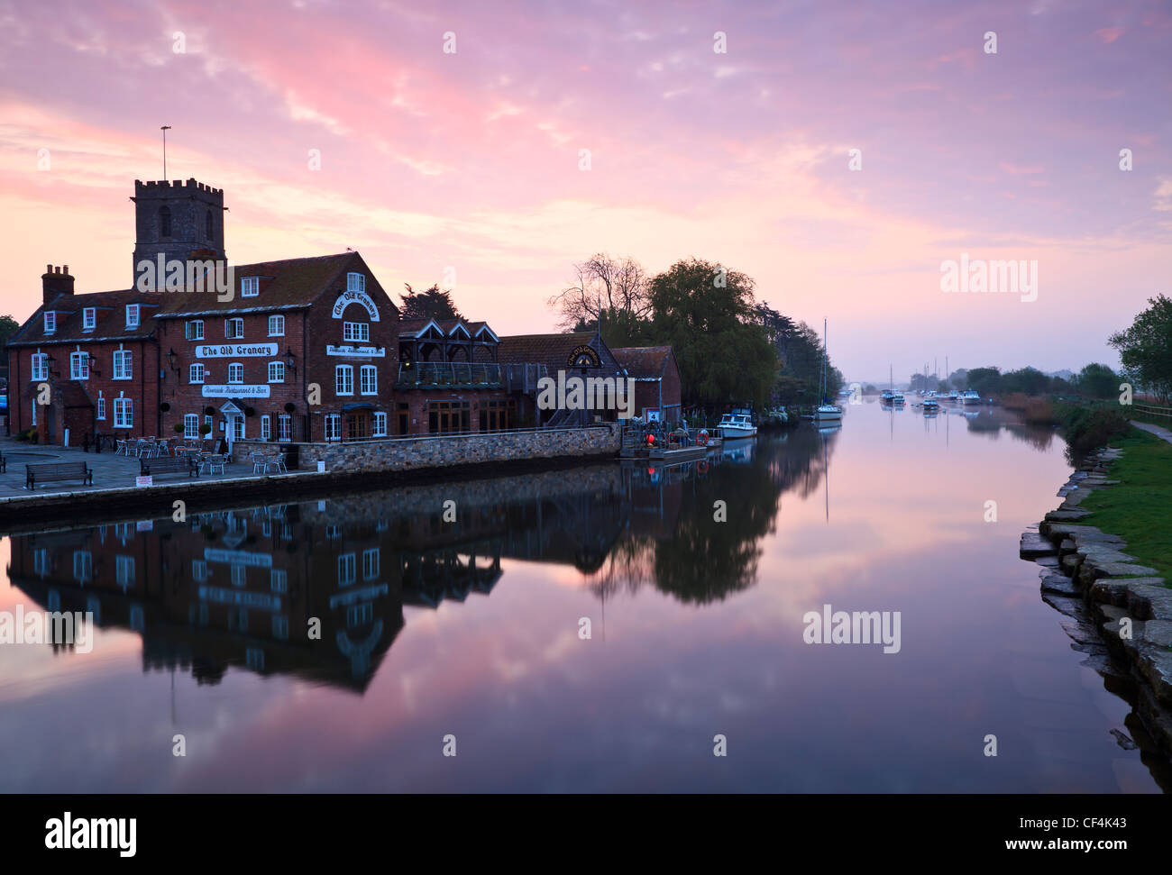 Dawn over The Old Granary, Riverside Restaurant and Bar by the River Frome at Wareham Quay. Stock Photo