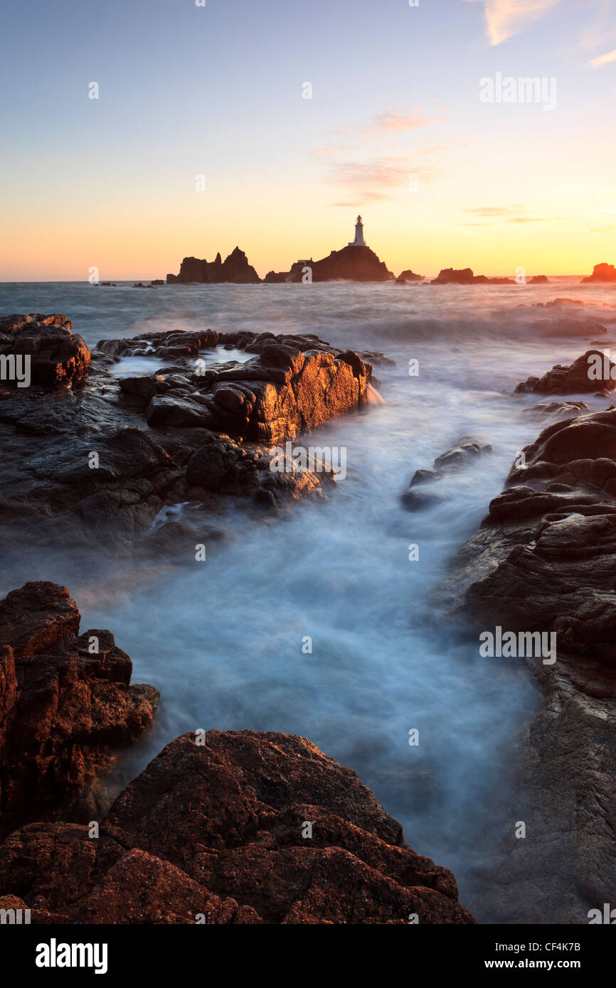 La Corbiere Lighthouse, the first in the British Isles to be built from concrete, at sunset. Stock Photo