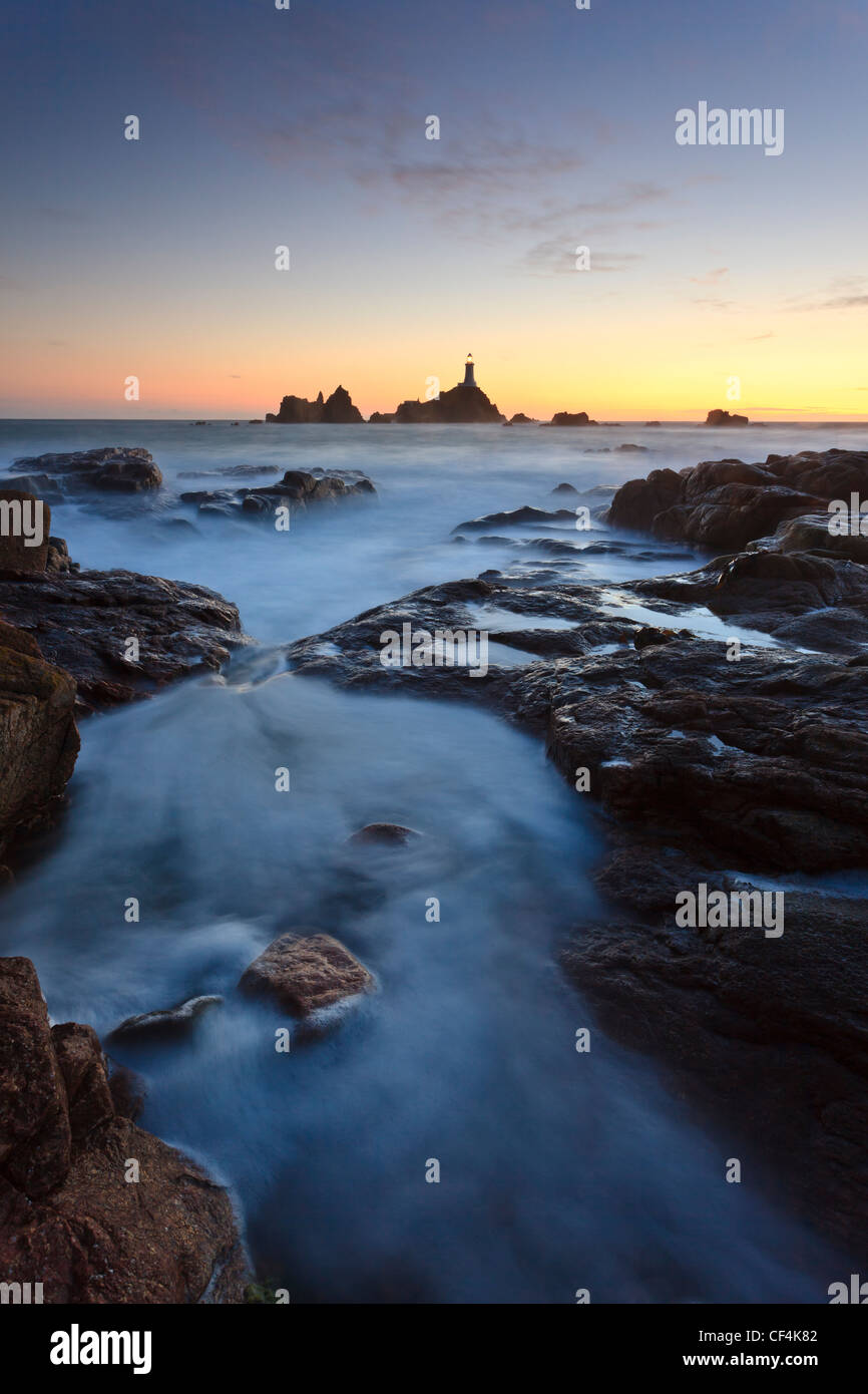 La Corbiere Lighthouse, the first in the British Isles to be built from concrete, at sunset. Stock Photo
