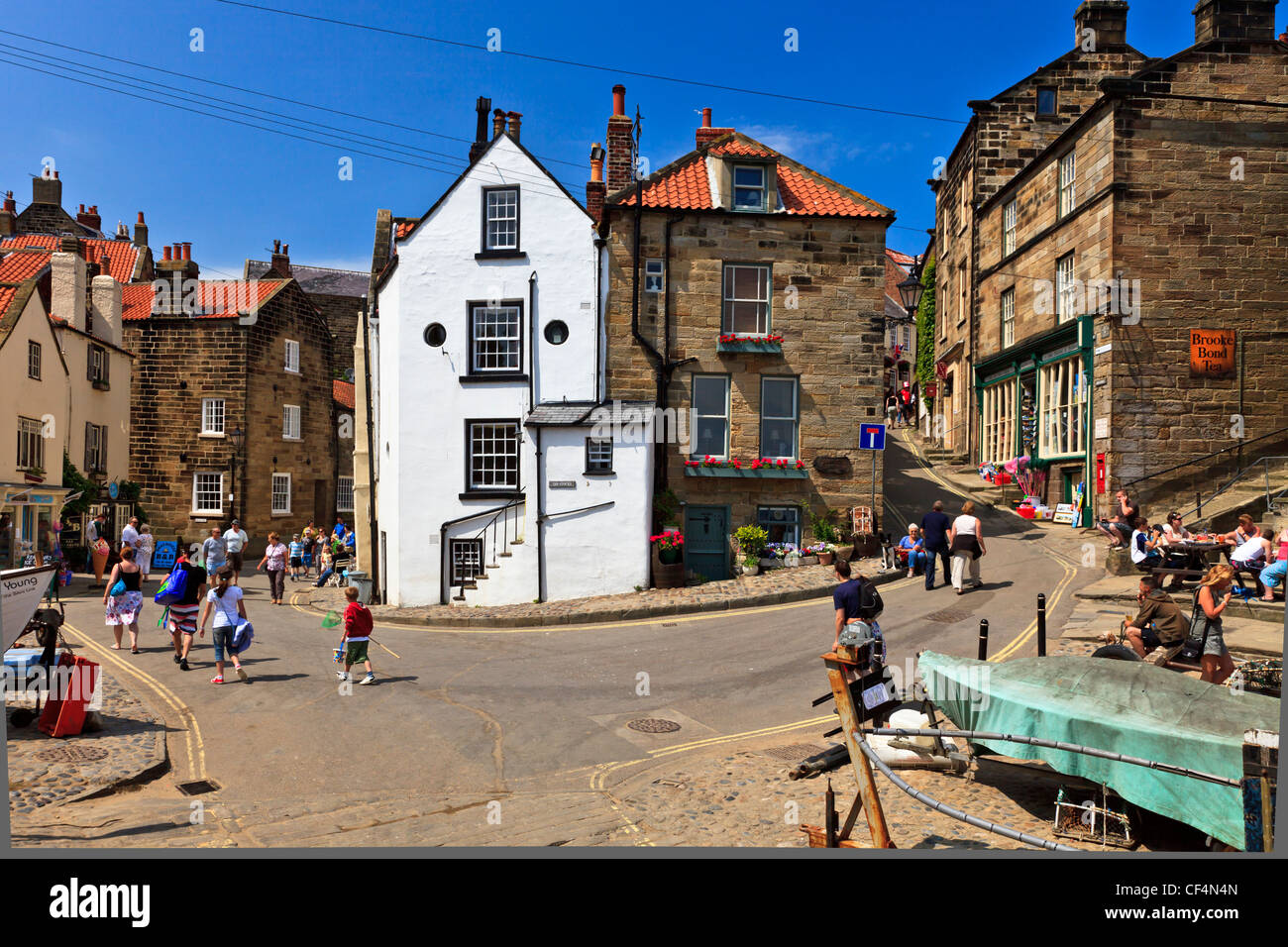Tourists in the centre of Robin Hood's Bay, the busiest smuggling community on the Yorkshire coast during the 18th century. Stock Photo