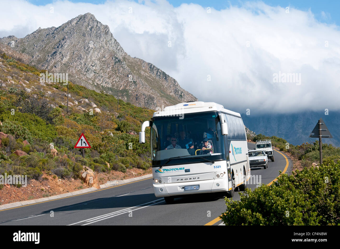 Tour bus on Clarence Drive a scenic coastal route near Gordon's Bay Western  Cape South Africa Stock Photo - Alamy