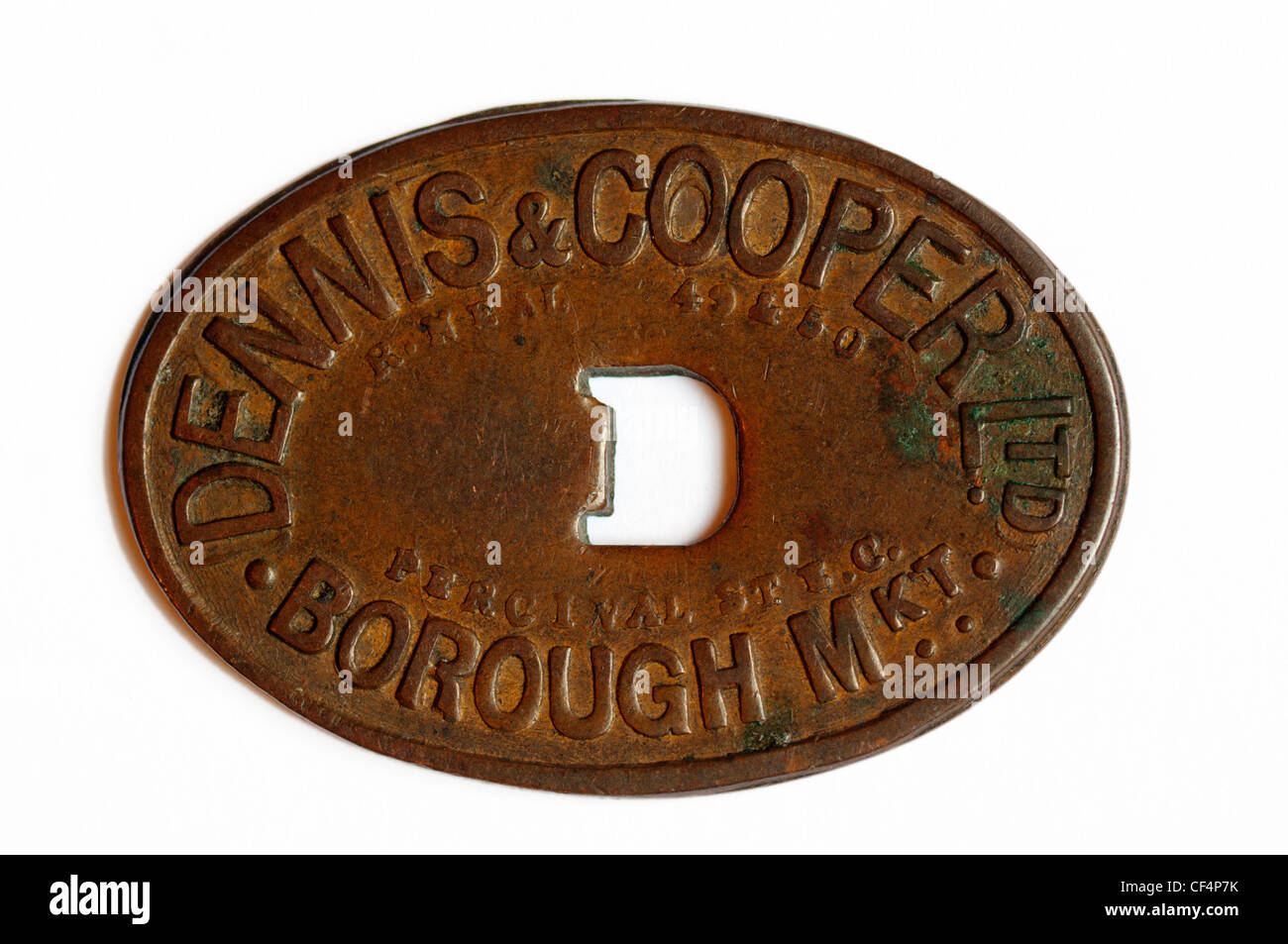 A market token, used by Dennis & Cooper of Borough Market.  SEE DESCRIPTION FOR DETAILS. Stock Photo