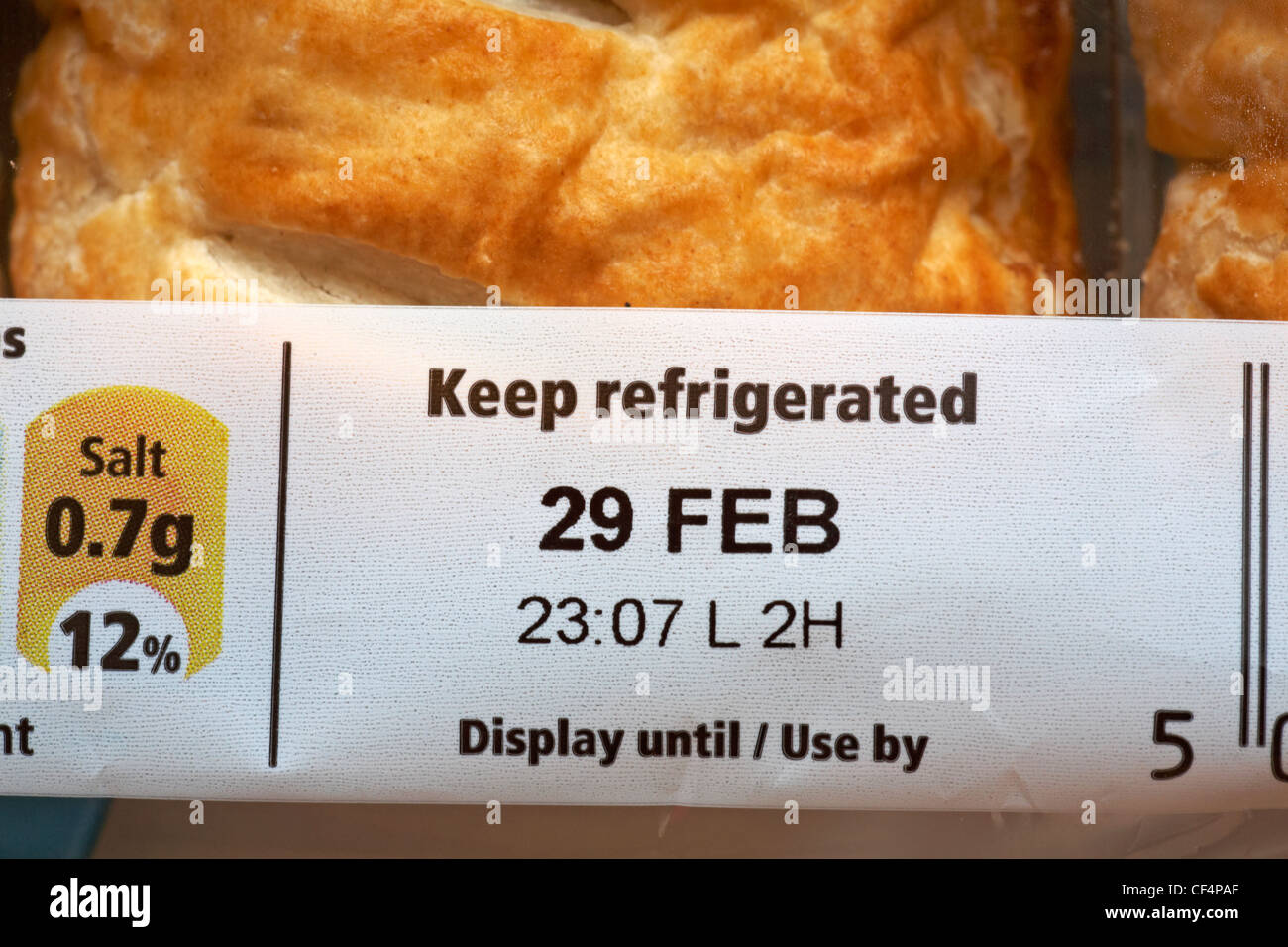 display until use by 29 Feb keep refrigerated advice on packet of sausage rolls Stock Photo