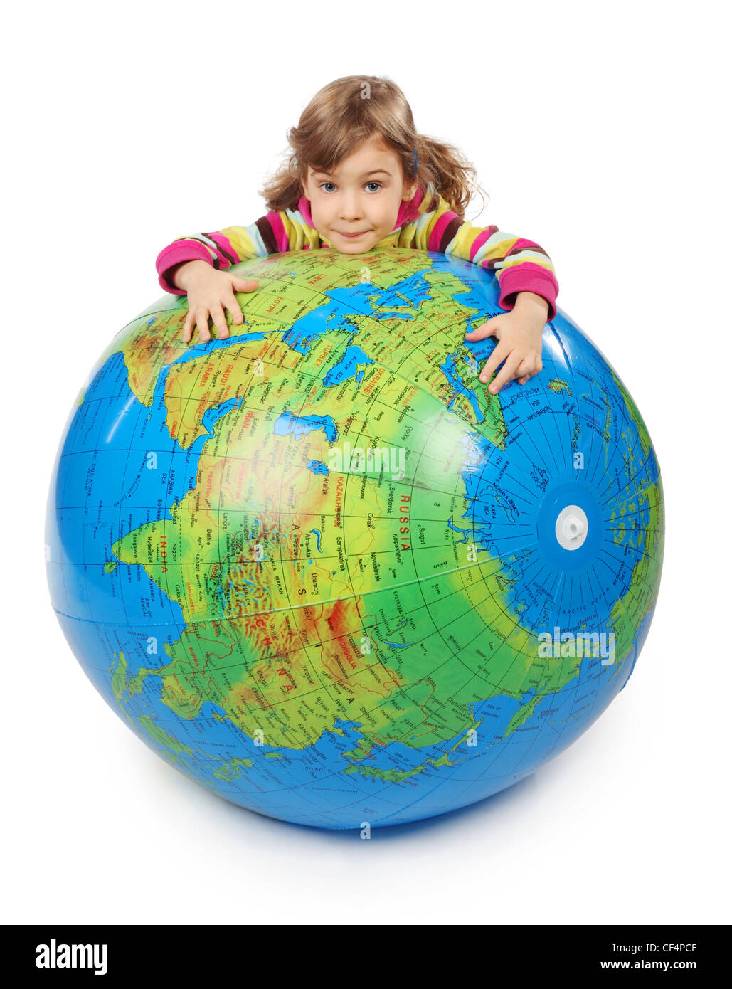 little girl look out of big inflatable globe and embracing it, isolated on white Stock Photo