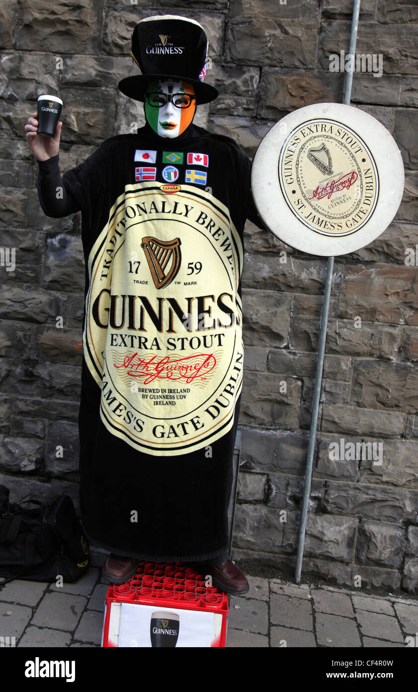Performance artist as living Guinness advertisement, outside Guinness Storehouse at St. James's Gate Brewery, one of Dublin's to Stock Photo