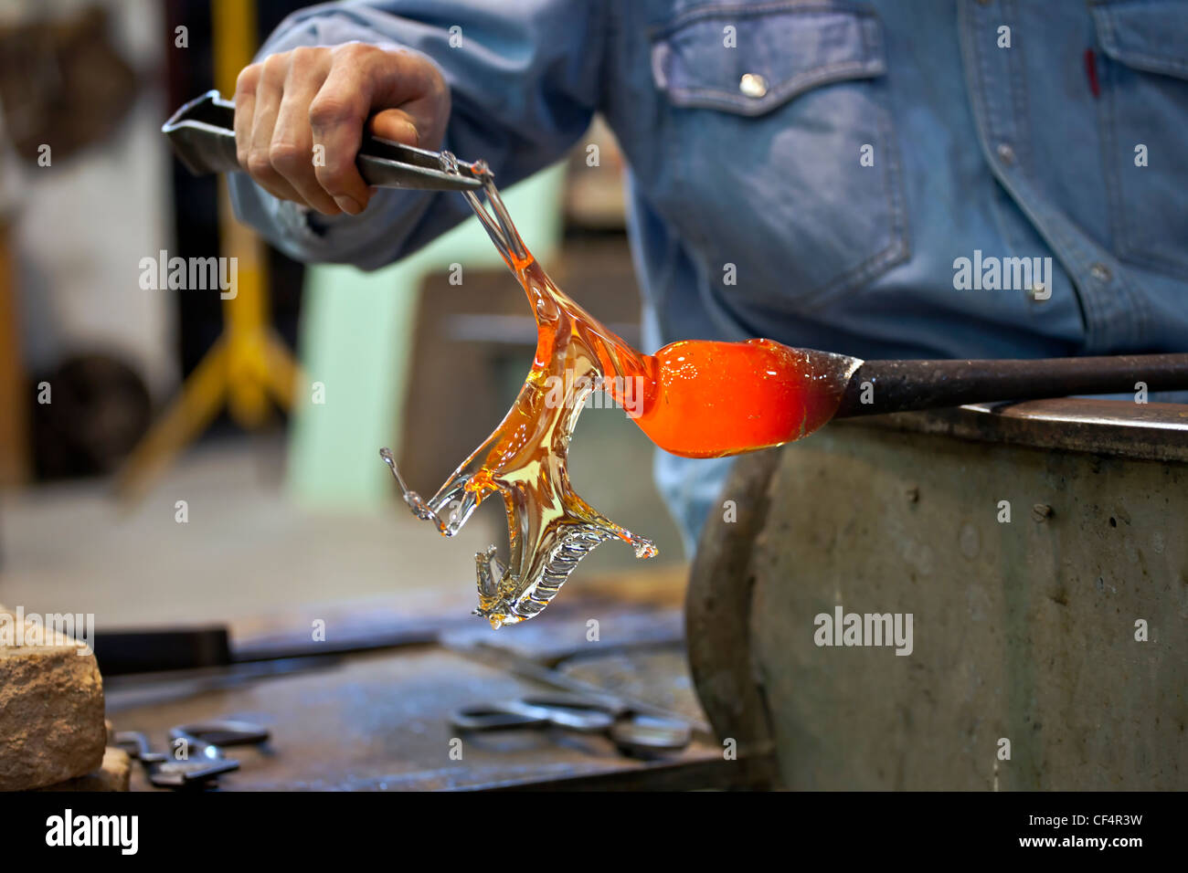 Art glass blower from Murano forms a figure Stock Photo