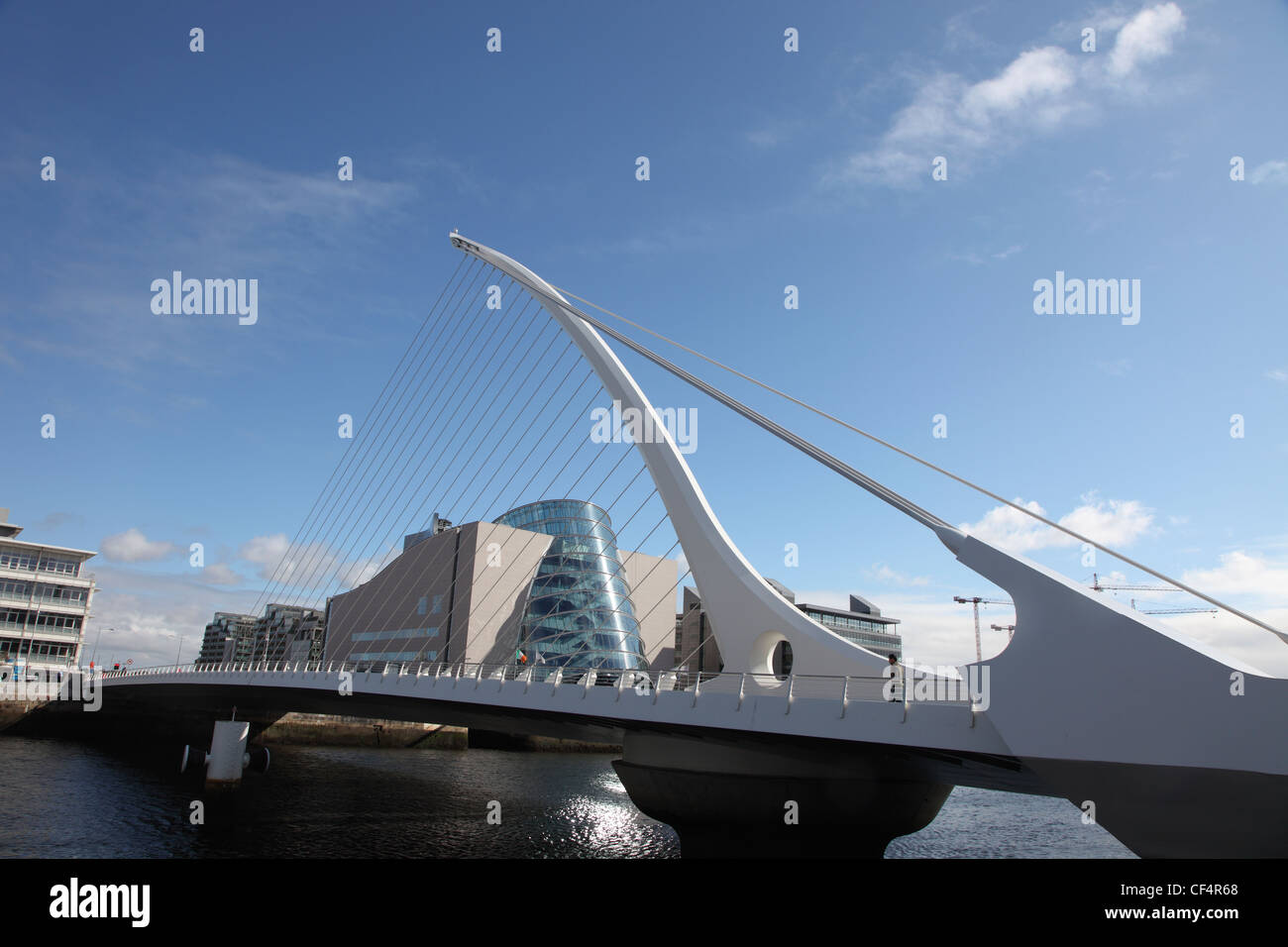 Samuel Beckett Bridge, a cable-stayed bridge designed by Spanish architect Santiago Calatrava that joins Sir John Rogerson's Qua Stock Photo