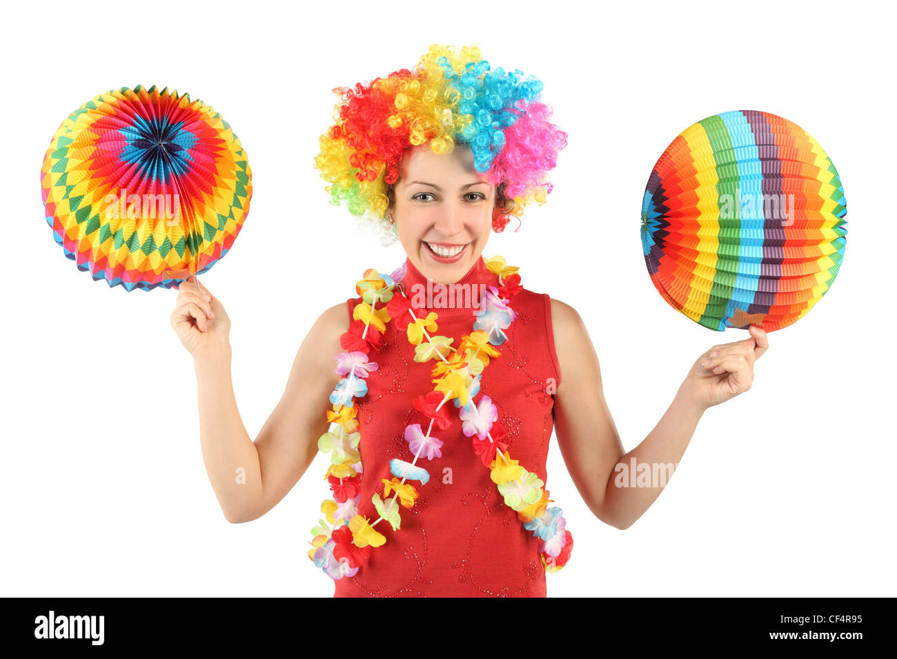 young beauty woman in clown wig, flower garland and multicolored decorative balls, smiling and