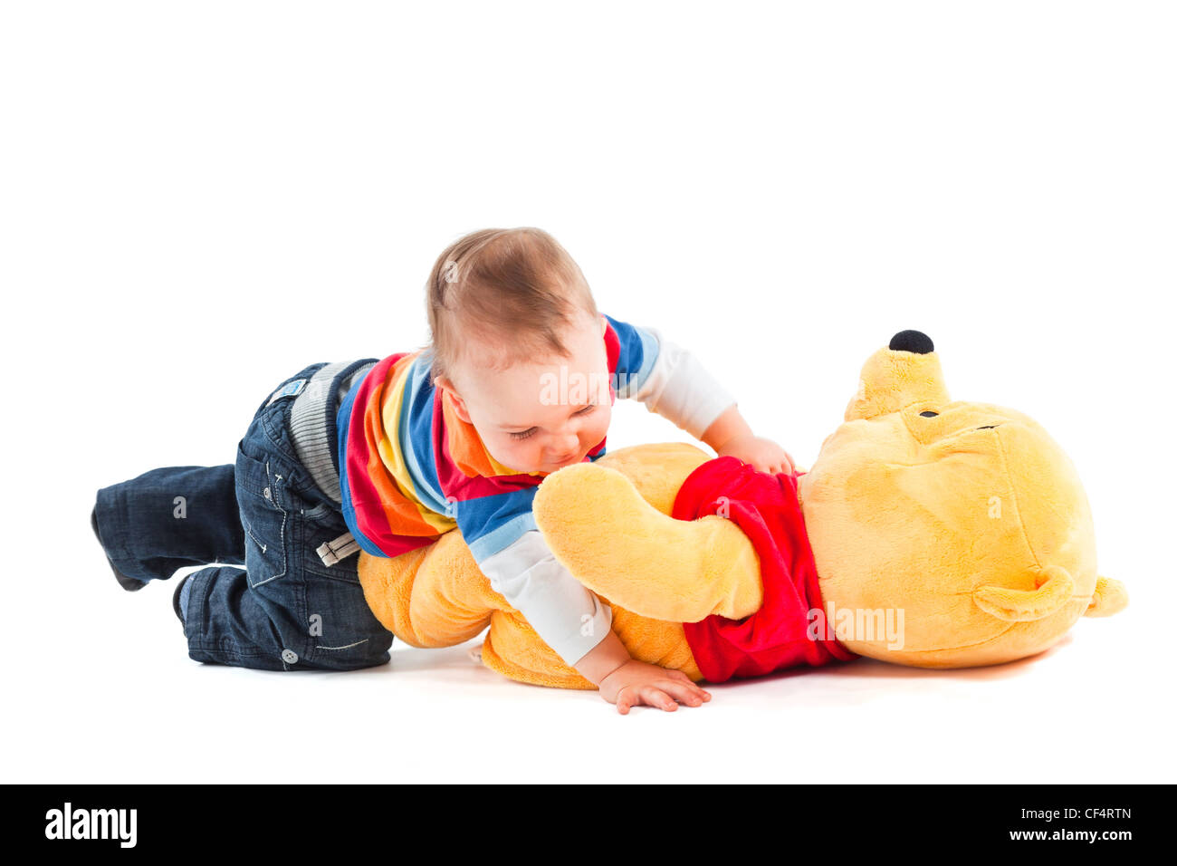 boy quarreling and retching bear toy on white background Stock Photo