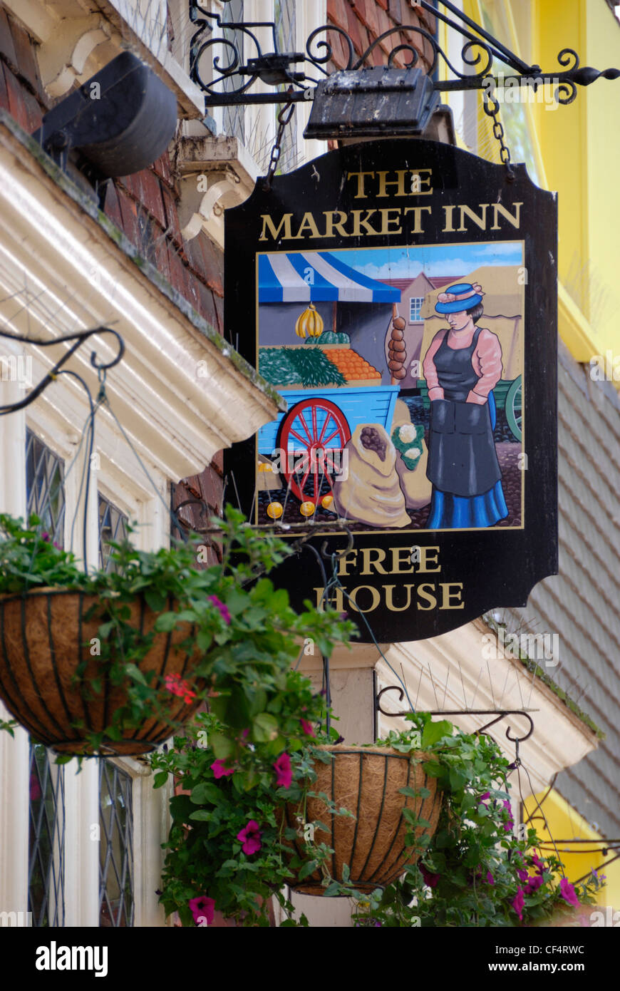 An inn sign hanging outside The Market Inn Free House in Butcher Row. Stock Photo