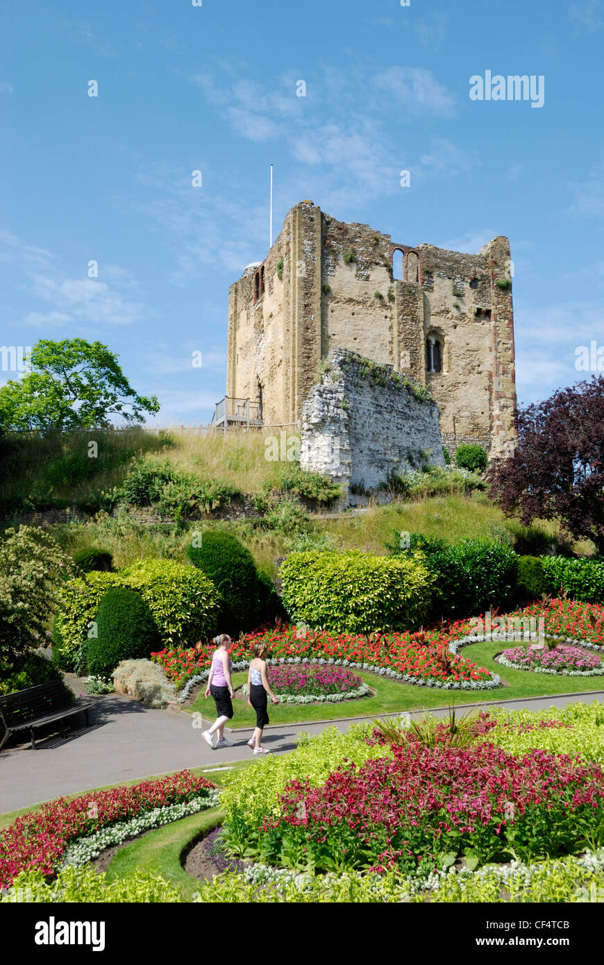 Two young girls walking in the grounds of Guildford Castle. Stock Photo