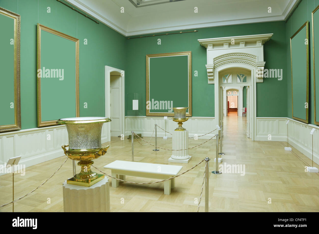 picture frames in green room of museum, white doors Stock Photo
