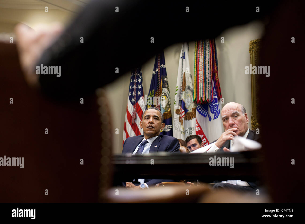 President Barack Obama and Chief of Staff Bill Daley listen during a ...