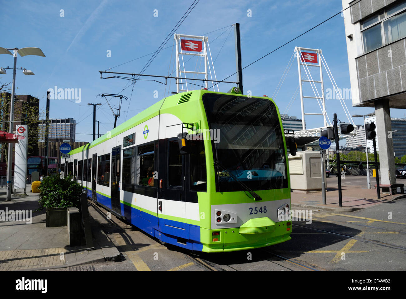 A tram on Croydon Tramlink outside East Croydon Railway Station. Stock Photo