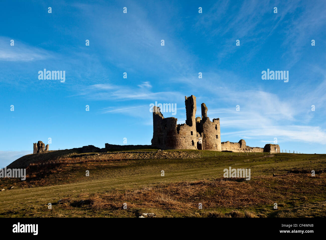 The remains of Dunstanburgh Castle, the largest castle in Northumberland, built in the 14th century. Stock Photo