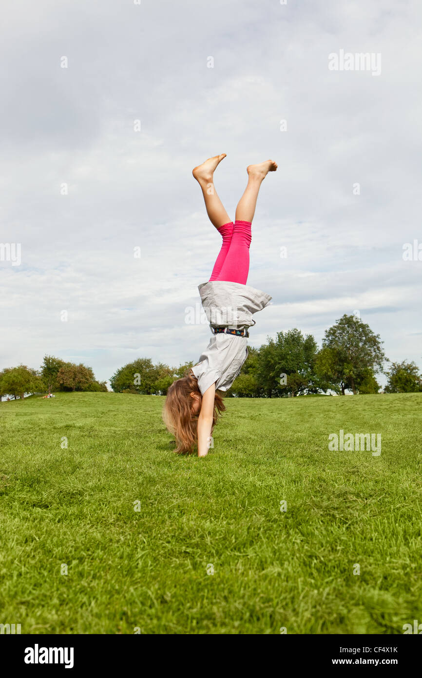 Germany, Bavaria, Girl jumping in park Stock Photo - Alamy