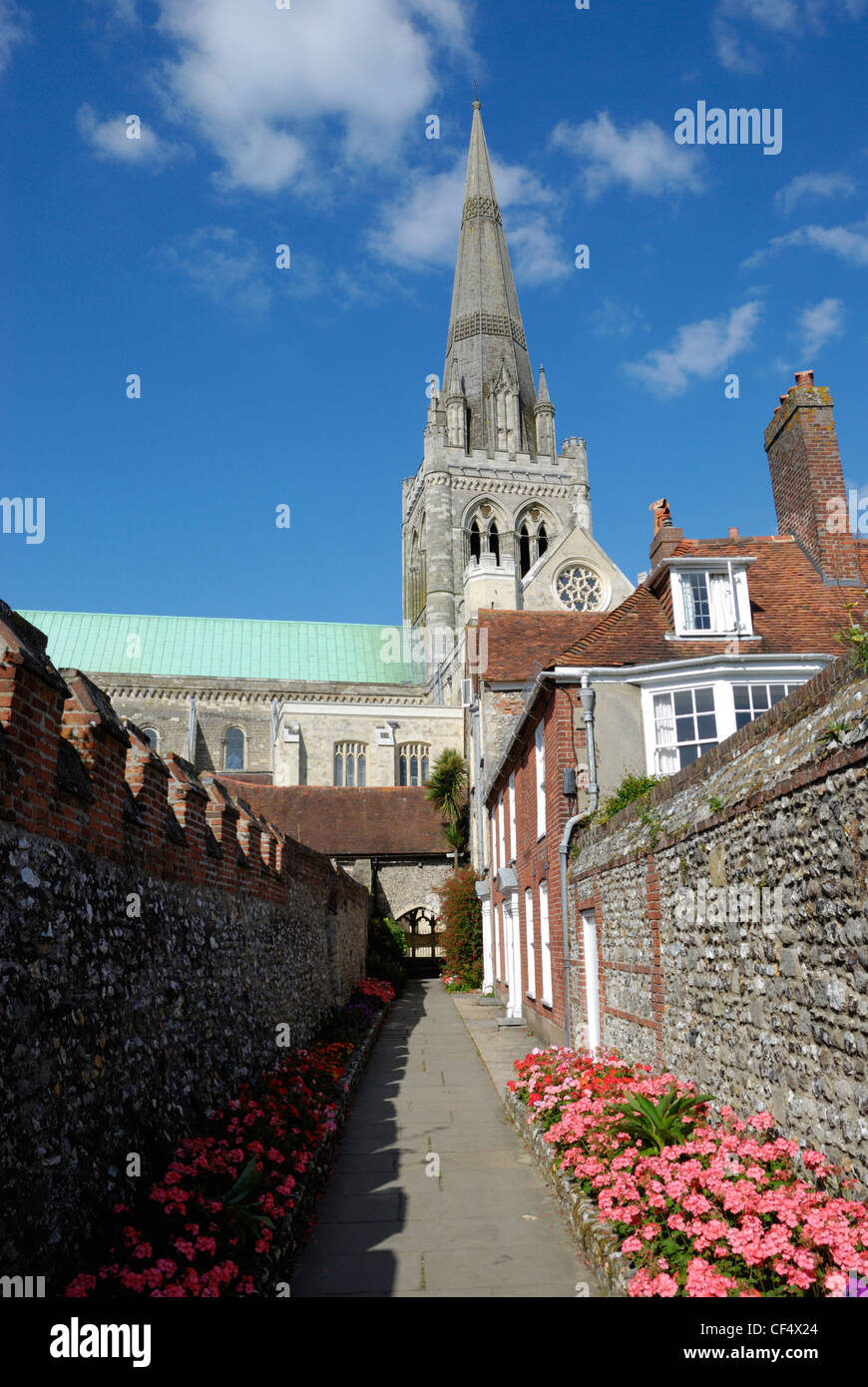 St Richard's Walk leading to Chichester Cathedral. The spire is a landmark for sailors as Chichester is the only English Cathedr Stock Photo