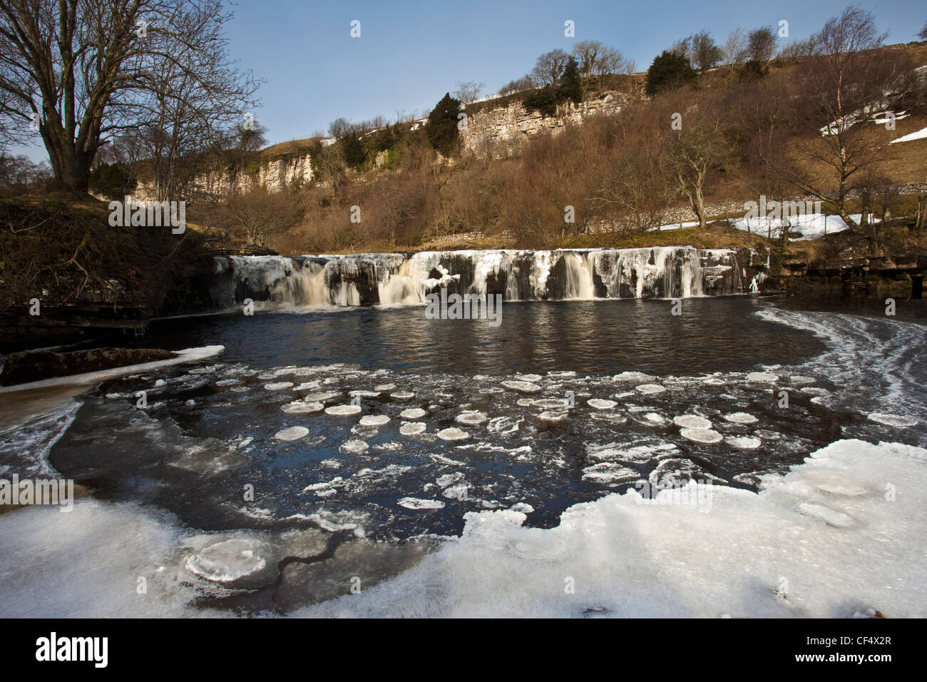 Wain Wath Force on the River Swale, frozen in winter, in the Yorkshire Dales National Park. Stock Photo