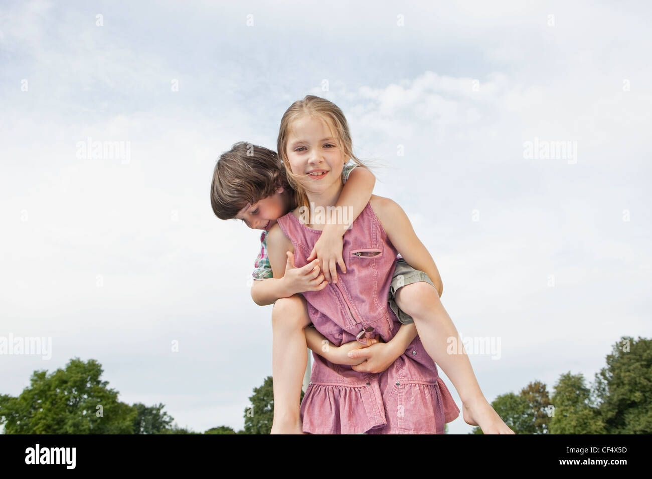 Woman Giving Little Boy Piggyback Ride Stock Photo, Picture and Royalty  Free Image. Image 10112006.