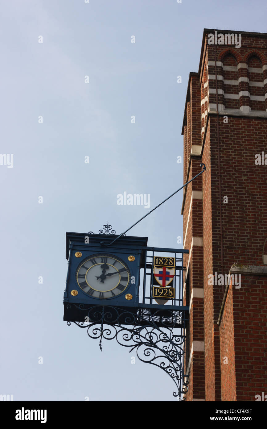The clock outside George Green School, Poplar, London Stock Photo
