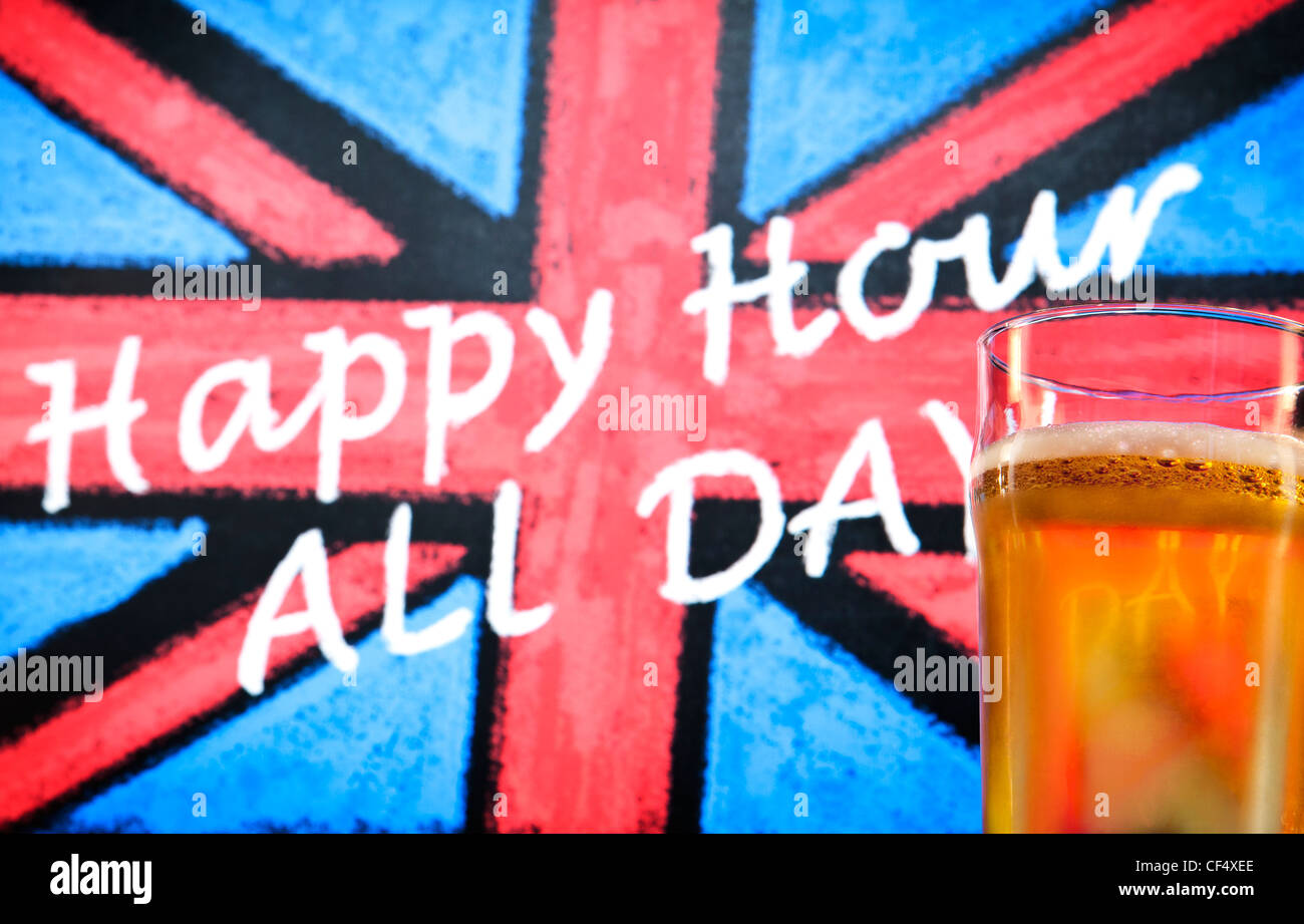 Blackboard pub sign with a chalk drawn Union Jack, which reads 'Happy