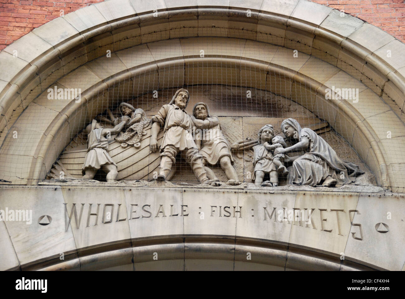 Sculptural relief of fishermen on the exterior of the former Manchester Wholesale Fish Markets. Stock Photo