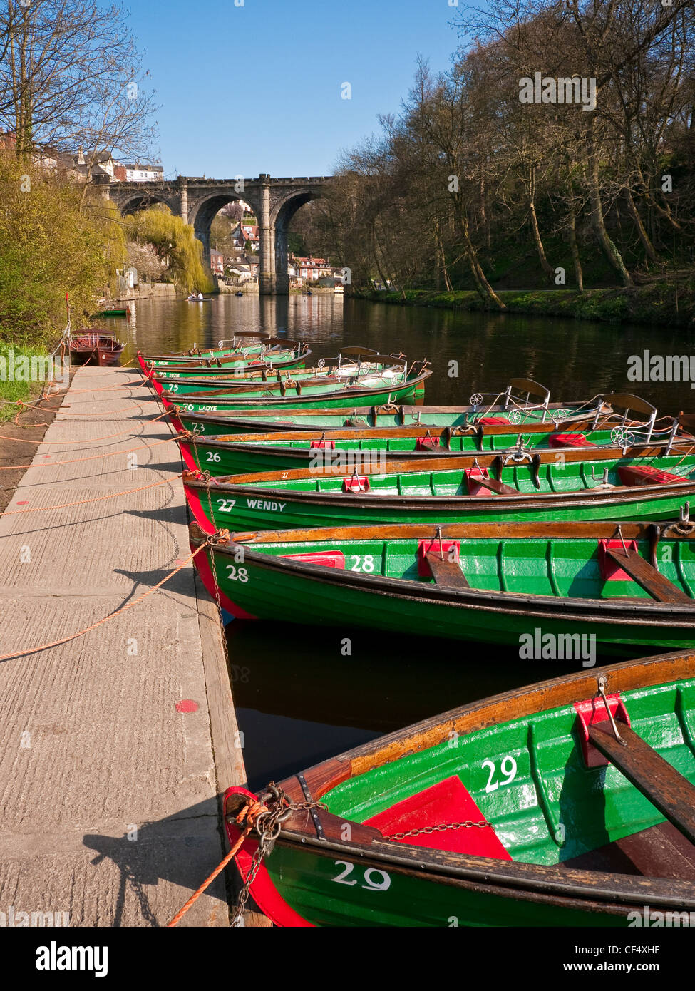 Rowing boats for hire on the River Nidd. The Knaresborough Viaduct