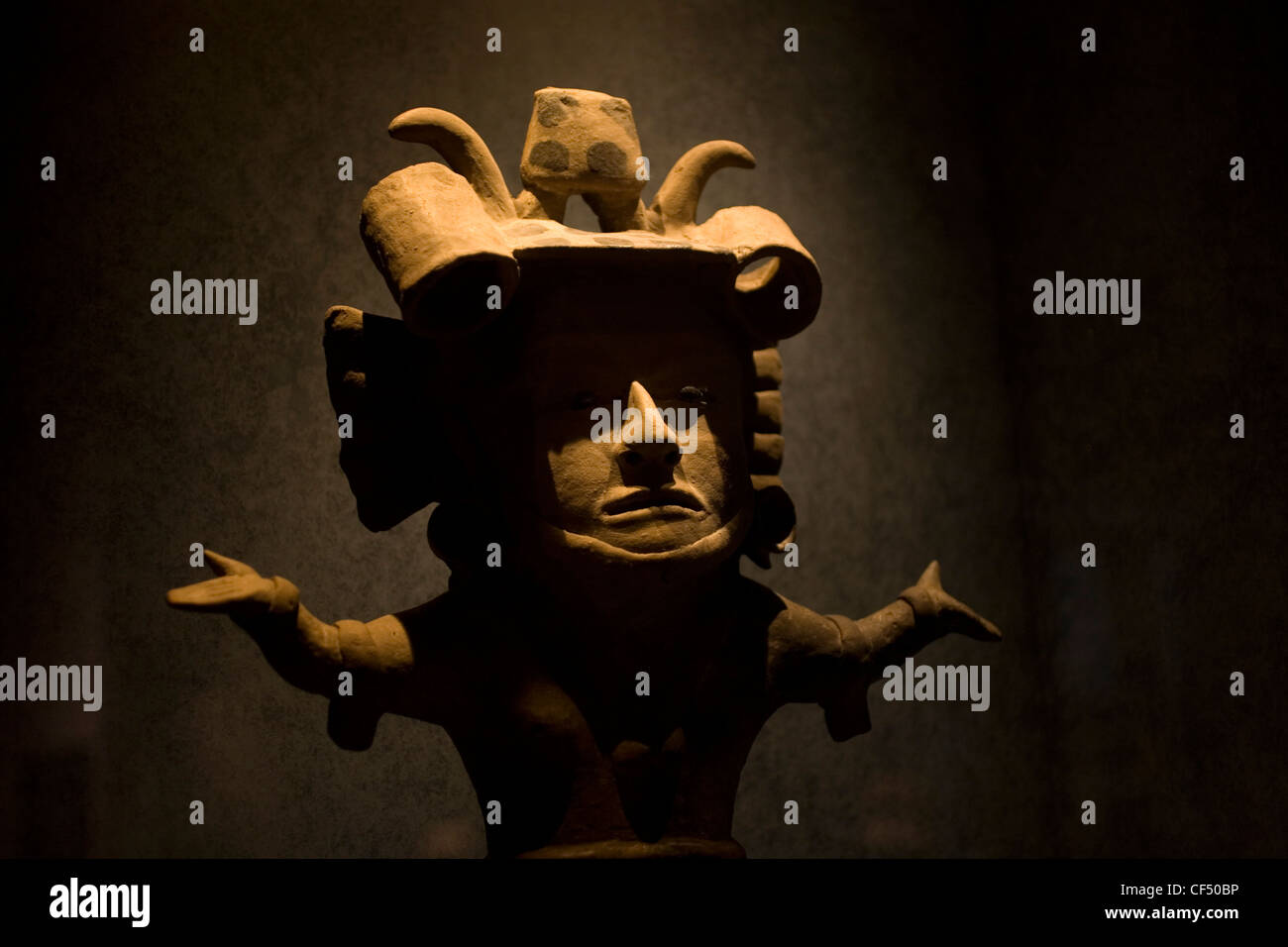 A clay statuette of a Olmec goddess with open arms is displayed in the National Museum of Anthropology in Mexico City Stock Photo