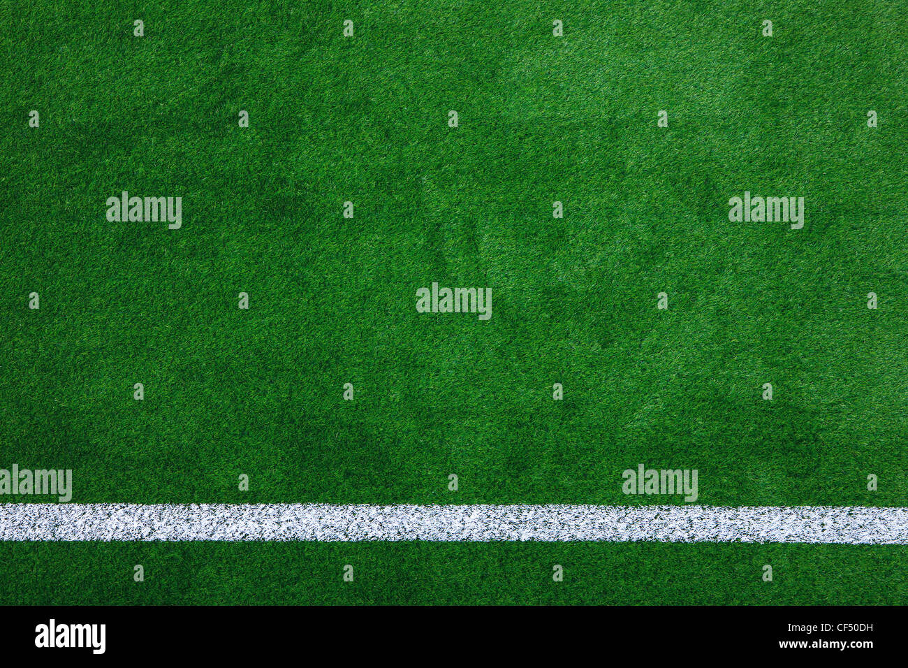 Green Synthetic Grass Sports Field with White Line Stock Photo