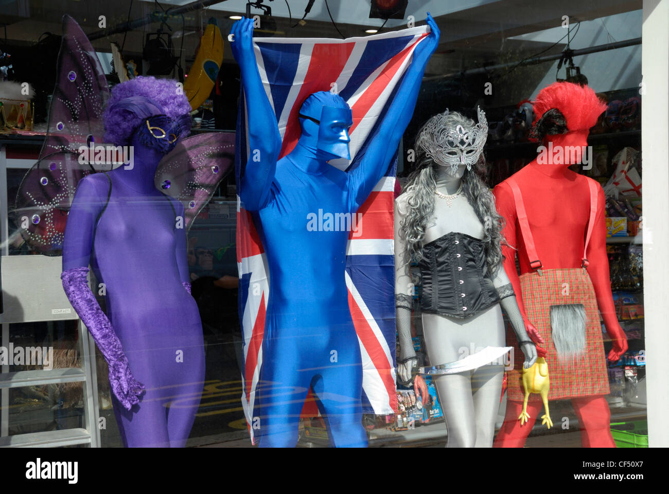 Mannequins dressed in outlandish fancy dress costumes on display in a