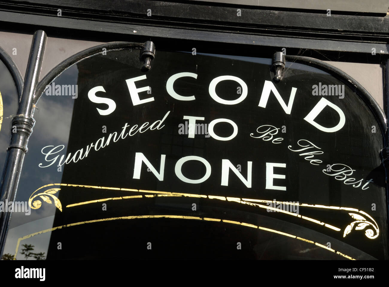'Second to None - Guaranteed to be the Best' sign on a shop window in Brighton. Stock Photo